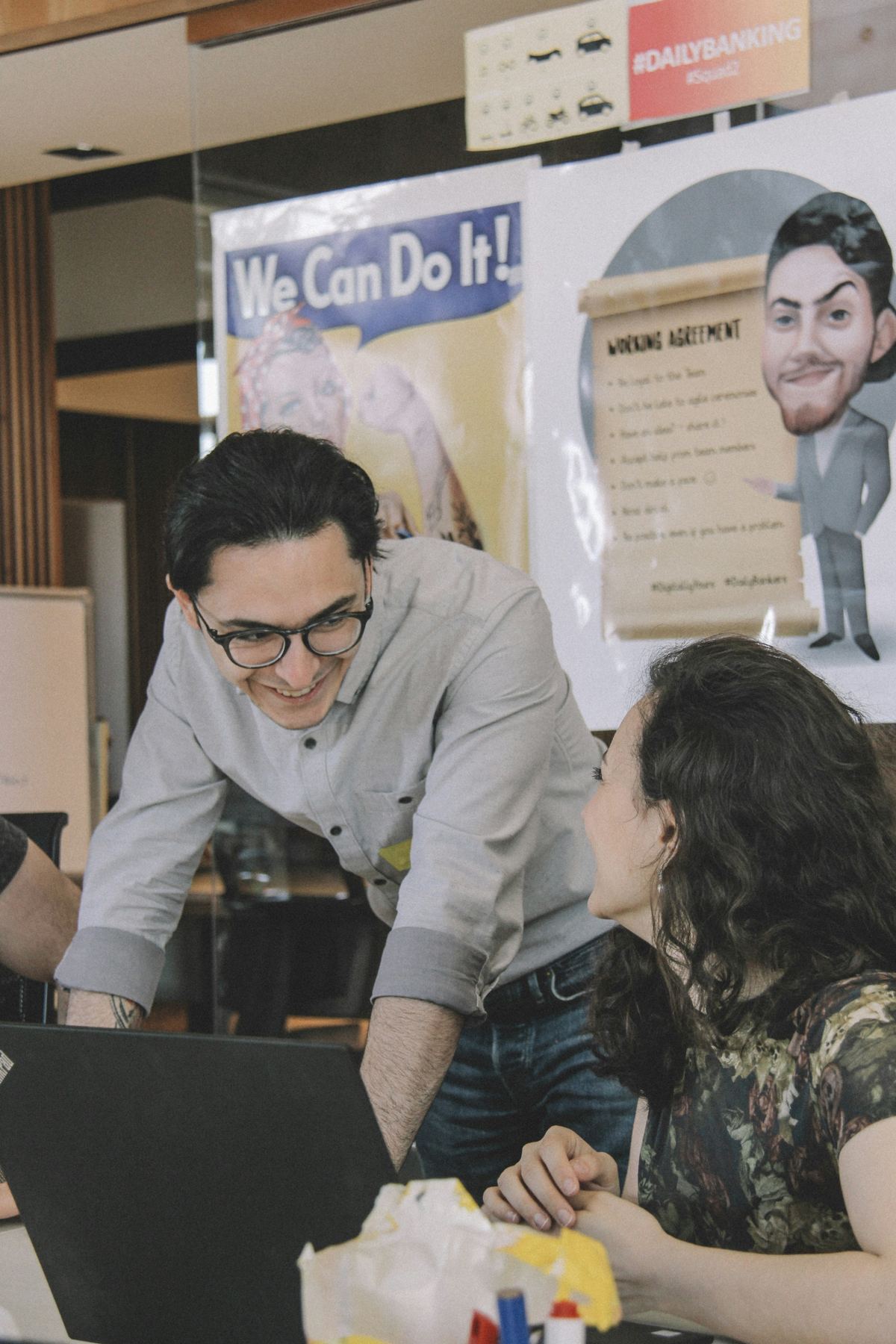 A team working together at a laptop